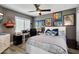 This bedroom features a bed, desk, and a window with shutters, for a relaxing work or sleep space at 10068 E San Salvador Dr, Scottsdale, AZ 85258
