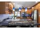 Modern kitchen featuring granite countertops, stainless steel appliances, and custom cabinetry at 10068 E San Salvador Dr, Scottsdale, AZ 85258