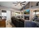 Cozy living room with plush sofa, fireplace, and large TV, perfect for relaxation at 10068 E San Salvador Dr, Scottsdale, AZ 85258