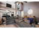 Comfortable living room with sectional sofa, two story ceilings and open access to other spaces at 10068 E San Salvador Dr, Scottsdale, AZ 85258