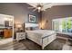 Bright main bedroom features neutral tones, vaulted ceiling, shutters, and ensuite bathroom access at 10068 E San Salvador Dr, Scottsdale, AZ 85258