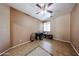 Bright bedroom with tile flooring, a ceiling fan, and a work desk at 10414 W Windsor Ave, Avondale, AZ 85392