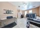 Bright bedroom with tile flooring, ceiling fan and open space at 10414 W Windsor Ave, Avondale, AZ 85392