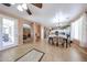 Open concept dining area and kitchen with tile floors, archways, and stainless steel appliances at 10414 W Windsor Ave, Avondale, AZ 85392