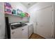 Bright laundry room with a modern washer and dryer, plus plenty of storage and a convenient door at 10414 W Windsor Ave, Avondale, AZ 85392