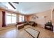 Cozy living room with tile floors, neutral paint, and comfortable sectional sofa at 10414 W Windsor Ave, Avondale, AZ 85392