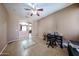 Bright room featuring tile flooring, a ceiling fan, and a home office at 10414 W Windsor Ave, Avondale, AZ 85392