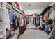 Spacious walk-in closet with ample hanging space, shelves, and storage for clothing and accessories at 10414 W Windsor Ave, Avondale, AZ 85392