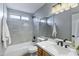 Updated bathroom features a bathtub, sleek vanity, and modern fixtures at 1119 W Ellis Dr, Tempe, AZ 85282