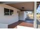 The covered patio offers an inviting transition from indoor to outdoor living, featuring a tile floor at 1119 W Ellis Dr, Tempe, AZ 85282