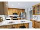 Bright kitchen with stainless steel appliances, white countertops, and custom wood cabinets at 1119 W Ellis Dr, Tempe, AZ 85282