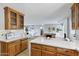 Open kitchen featuring stainless steel appliances, natural wood cabinets, and a breakfast bar at 1119 W Ellis Dr, Tempe, AZ 85282
