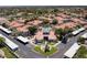 Aerial view showcasing the community clubhouse, pool, parking, and lush landscaping at 11375 E Sahuaro Dr # 1055, Scottsdale, AZ 85259