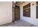 Inviting condo entrance featuring an exterior light fixture and security screen at 11375 E Sahuaro Dr # 1055, Scottsdale, AZ 85259