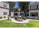 Exterior of the complex with green space including a built-in grill and table at 11375 E Sahuaro Dr # 1055, Scottsdale, AZ 85259