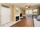 Bright living room with fireplace, tile entry, wood floors and sliding doors to patio at 11375 E Sahuaro Dr # 1055, Scottsdale, AZ 85259