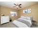 Bright main bedroom featuring a queen bed, modern ceiling fan and neutral paint at 11375 E Sahuaro Dr # 1055, Scottsdale, AZ 85259