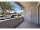 Covered patio with a view of the parking lot and foliage at 11375 E Sahuaro Dr # 1055, Scottsdale, AZ 85259
