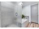 Relaxing bathroom featuring enclosed glass shower and bathtub at 120 E Rio Salado Pkwy # 101, Tempe, AZ 85281