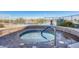 Relaxing spa with a blue handrail, overlooking a serene lake, with trees in the background at 120 E Rio Salado Pkwy # 101, Tempe, AZ 85281