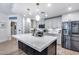 Modern kitchen features a large island with quartz countertop, stainless steel appliances, and pendant lighting at 120 E Rio Salado Pkwy # 101, Tempe, AZ 85281