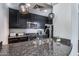 Modern kitchen features granite countertops, stainless steel appliances, and ample cabinet space at 120 E Rio Salado Pkwy # 101, Tempe, AZ 85281