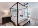 Bright main bedroom featuring a four-poster bed, ceiling fan, and view of city at 120 E Rio Salado Pkwy # 101, Tempe, AZ 85281