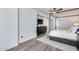 Spacious main bedroom with wood floors, ceiling fan, and lots of natural light at 120 E Rio Salado Pkwy # 101, Tempe, AZ 85281