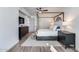 Bright main bedroom features a four-poster bed and wood flooring at 120 E Rio Salado Pkwy # 101, Tempe, AZ 85281