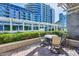 Inviting patio featuring comfortable seating, beautiful landscaping, shade structure, and a building backdrop at 120 E Rio Salado Pkwy # 101, Tempe, AZ 85281