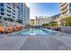 Gorgeous pool area with ample lounge chairs, landscaping, and views of the surrounding buildings at 120 E Rio Salado Pkwy # 101, Tempe, AZ 85281