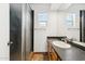 Bathroom with modern fixtures including granite countertop and a glass-enclosed shower at 1238 E Cambridge Ave, Phoenix, AZ 85006