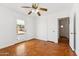 Bedroom with parquet floors, door to backyard, ceiling fan at 1238 E Cambridge Ave, Phoenix, AZ 85006