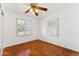 Bedroom featuring parquet floors, ceiling fan and shuttered windows at 1238 E Cambridge Ave, Phoenix, AZ 85006