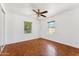 Bright bedroom with two windows, parquet floors and ceiling fan at 1238 E Cambridge Ave, Phoenix, AZ 85006