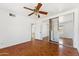 Bright bedroom with parquet floors, ceiling fan, and mirrored closet at 1238 E Cambridge Ave, Phoenix, AZ 85006