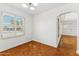 Dining room featuring shuttered windows, hardwood floors and an archway entrance at 1238 E Cambridge Ave, Phoenix, AZ 85006
