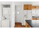 A convenient laundry area with a washer and dryer adjacent to the kitchen at 1238 E Cambridge Ave, Phoenix, AZ 85006