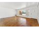 Spacious living room with an open layout, built-in shelving, and large window for natural light at 1238 E Cambridge Ave, Phoenix, AZ 85006