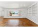 Bright living room featuring a large window with outdoor views and classic built-in shelving at 1238 E Cambridge Ave, Phoenix, AZ 85006