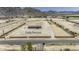 Expansive desert property featuring a fully fenced lot, horse property, and charming single-Gathering home at 13050 N Breeze Way, Maricopa, AZ 85139