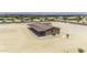 Aerial view featuring the home with a covered patio area and surrounding land at 13050 N Breeze Way, Maricopa, AZ 85139