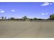 Expansive driveway leading to a property, providing ample space for vehicles at 13050 N Breeze Way, Maricopa, AZ 85139