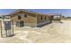 View of the side of the home with outdoor AC unit at 13050 N Breeze Way, Maricopa, AZ 85139