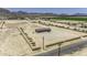 Angle of the property from the street showing a large plot, dirt lot, and exterior paint at 13050 N Breeze Way, Maricopa, AZ 85139