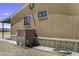 Exterior view showing siding, air conditioning unit, and desert landscaping at 13050 N Breeze Way, Maricopa, AZ 85139