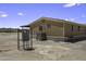 Exterior showcasing the mobile home design with an electrical box and AC unit at 13050 N Breeze Way, Maricopa, AZ 85139
