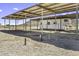 Exterior of the property showing horse property, storage, trailer parking with a metal covering at 13050 N Breeze Way, Maricopa, AZ 85139
