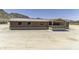 Angle view of the home with covered porch at 13050 N Breeze Way, Maricopa, AZ 85139