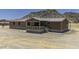 Inviting home with neutral siding, covered porch, and mountain backdrop at 13050 N Breeze Way, Maricopa, AZ 85139